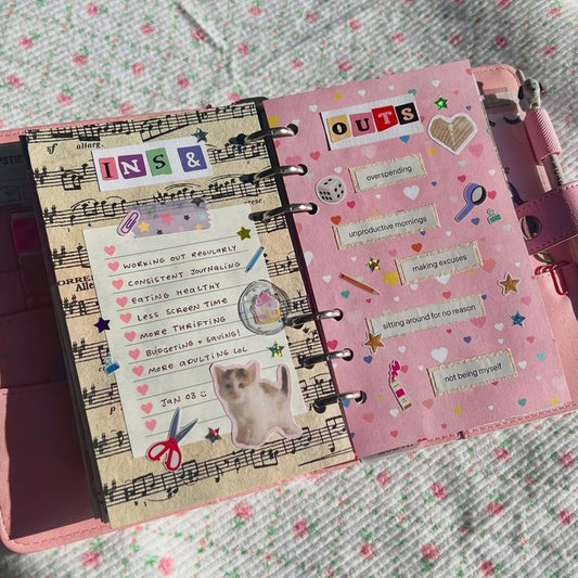 Decorated junk journal page showing 'ins' and 'outs'. The 'ins' focus on things like exercise, budgeting, and socialising.